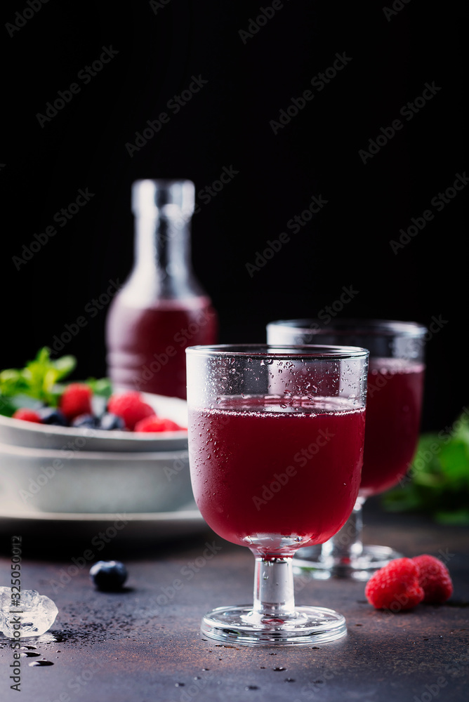 Glasses of a red berry juice Glasses of a red berry juice