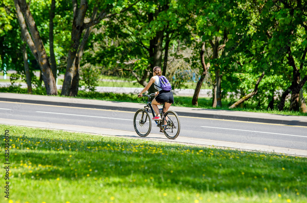 Cyclist ride on the bike path in the city Park