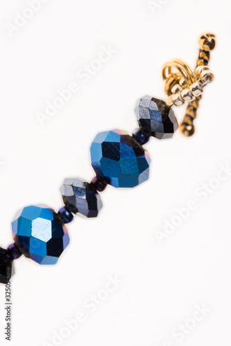 bead decoration. necklace and bracelet. blue beads. clasp on the decoration. a grid of beads. Japanese beads in decoration