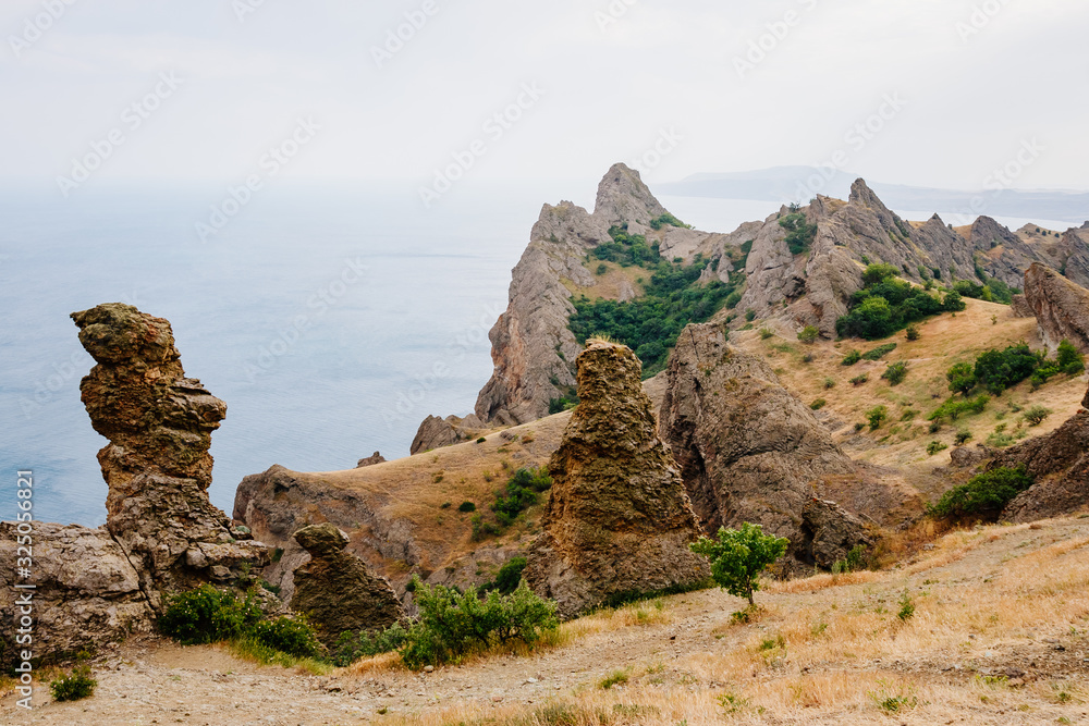 Karadag mountain range in Crimean mountains, an ancient extinct volcano. Karadag mountain range in Crimean mountains, an ancient extinct volcano.