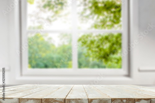 desk of free space and spring window background 
