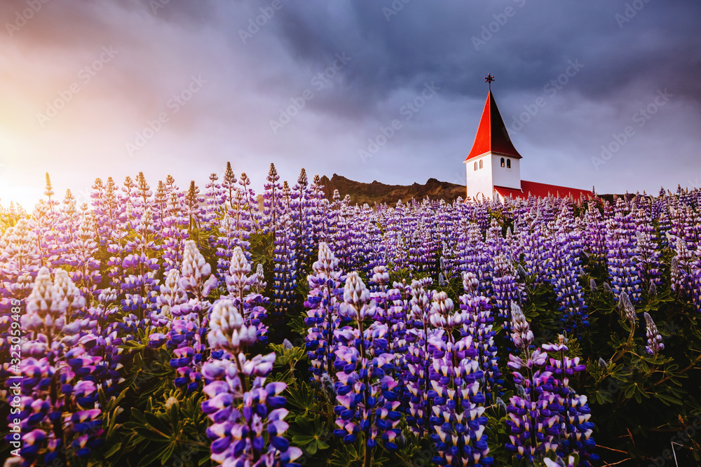 Great view of Vikurkirkja christian church. Location place Vik i Myrdal village, Iceland, Europe.