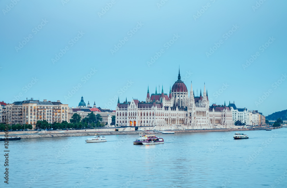 Fototapeta premium Evening view of Hungarian Parliament with Margit bridge. Famous place Budapest, Hungary, Europe.