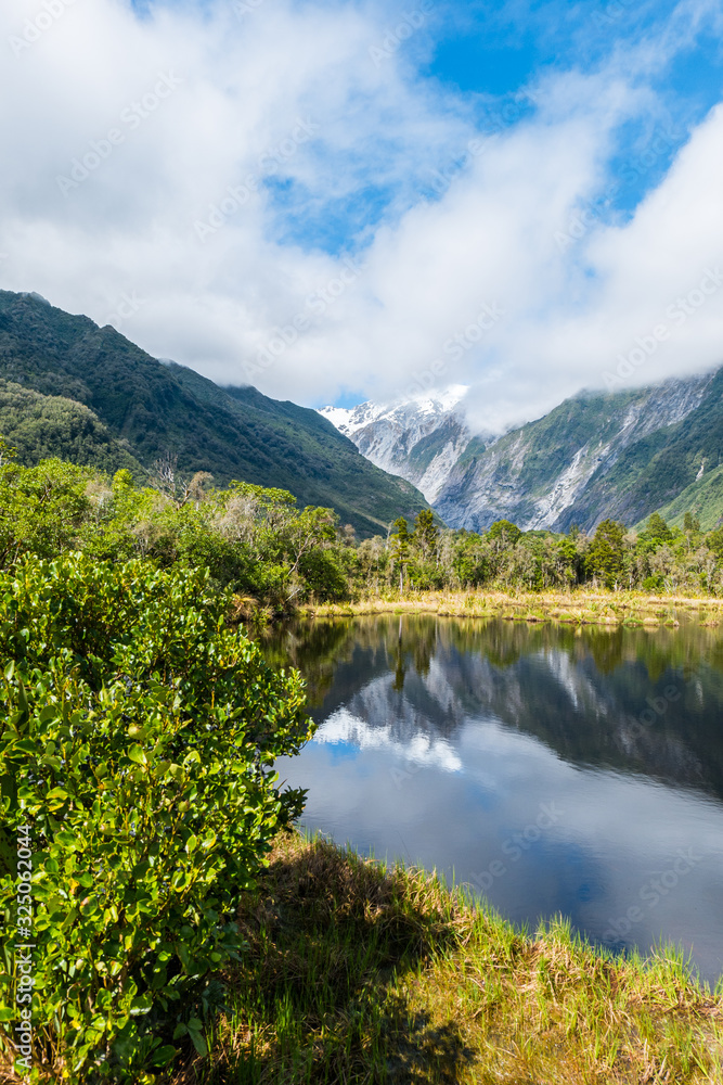 Mountain mirroring in lake New Zealand