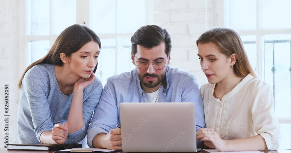 Male mentor explaining web design project data teach female interns Male mentor explaining web design project data teach female interns