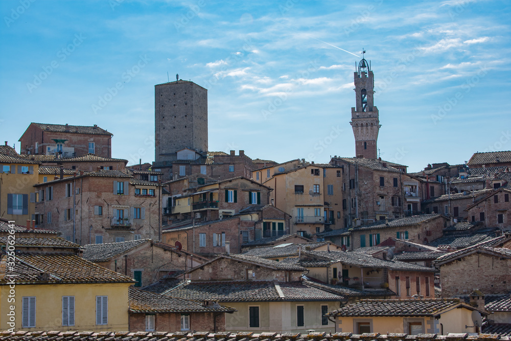 Beautiful panoramic view of the historic city of Siena at summer day with blue sky Tuscany, Italy