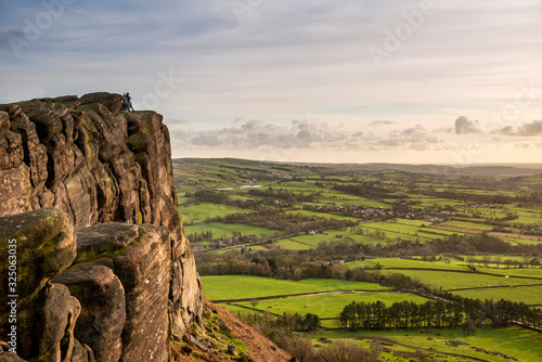 Epic Peak District Winter landscape of view from top of Hen Cloud over countryside and towards Tittesworth Reservoir photo