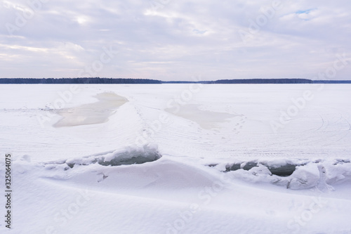 Wallpaper Mural Landscape of a frozen lake in winter. The surface of the water in the lake is covered with snow and ice. Torontodigital.ca