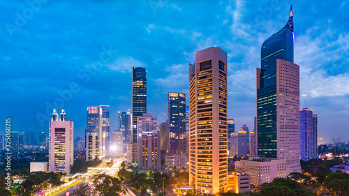 Aerial view of Jakarta's Central Business District at dusk (blue hour). Jakarta cityscape at sunset. Central Jakarta nightlife.