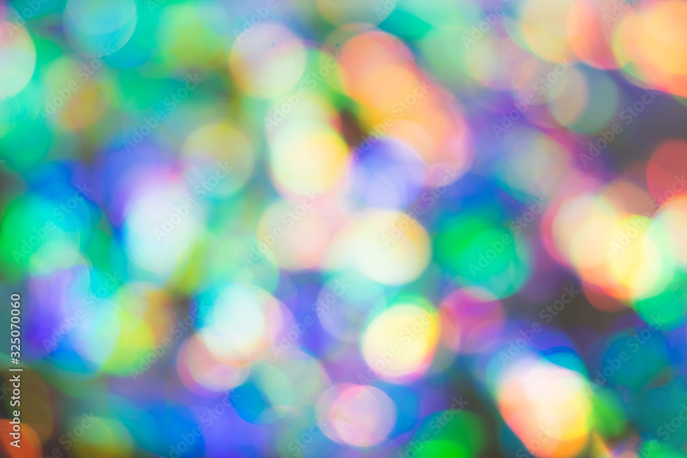 Delicate glitter bokeh rainbow background. Creative and moody color of the picture.