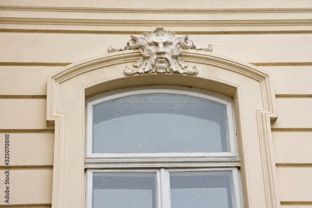 Window frame with stucco sculpture over the window. Background for ancient buildings. Window frame with stucco sculpture over the window. Background for ancient buildings.