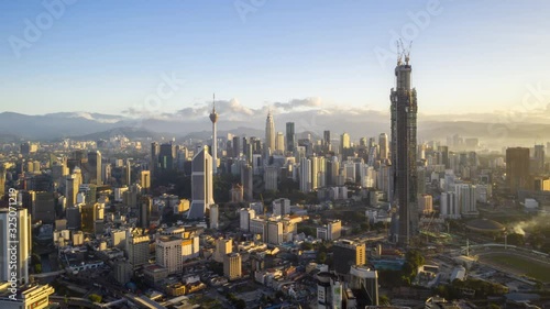 Wallpaper Mural Kuala Lumpur, Malaysia - January 5, 2020: 4k establishing b-roll cinematic shot of hyperlapse drone panning view of sunrise at Kuala Lumpur city skyline.  Torontodigital.ca