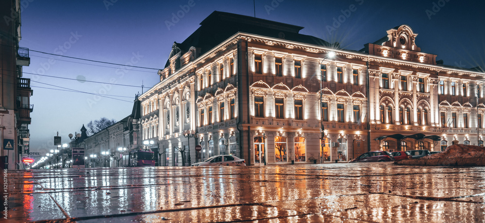 old city center street at night after rain