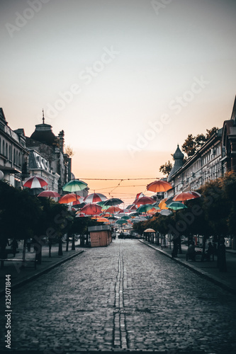 umbrellas at sunset in old city center