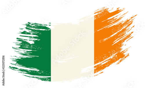 Fotografie Irish flag grunge brush background. Vector illustration.