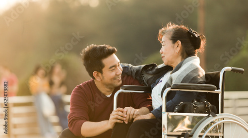 Portrait of Asian senior mother and young man son smile and happy face