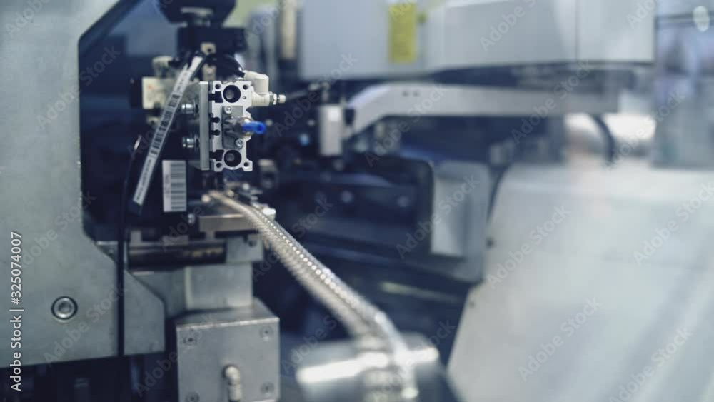 Close up of industrial machine. Close up view of production machine operation Close up of industrial machine. Close up view of production machine operation