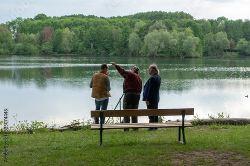 men at lake