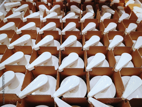 High Angle View of White Bottles with Liquid Dispensing Heads for Sale at Store