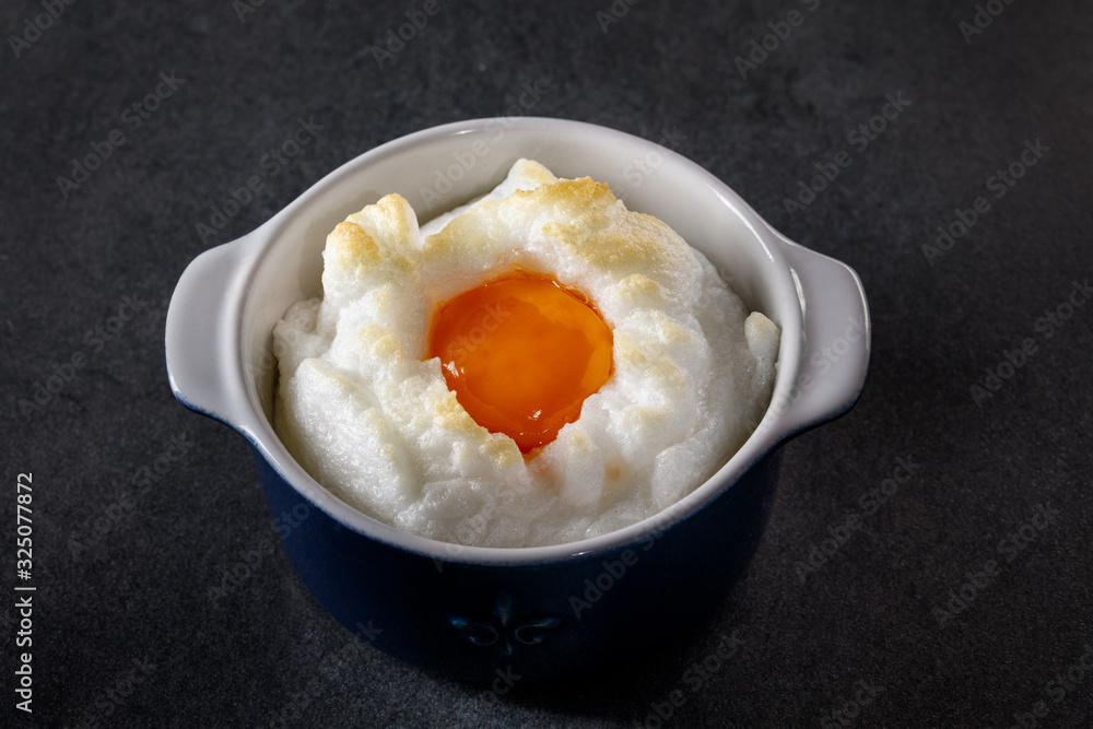 Delicate baked egg Orsini (eggs in the cloud). French breakfast. Delicate baked egg Orsini (eggs in the cloud). French breakfast.