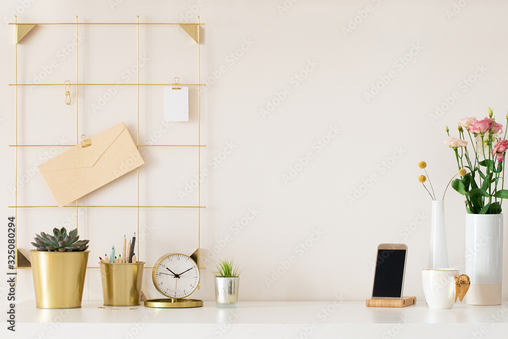 Modern office desk with gold accessories. Empty space, mock up. Minimal style. Modern office desk with gold accessories. Empty space, mock up. Minimal style.