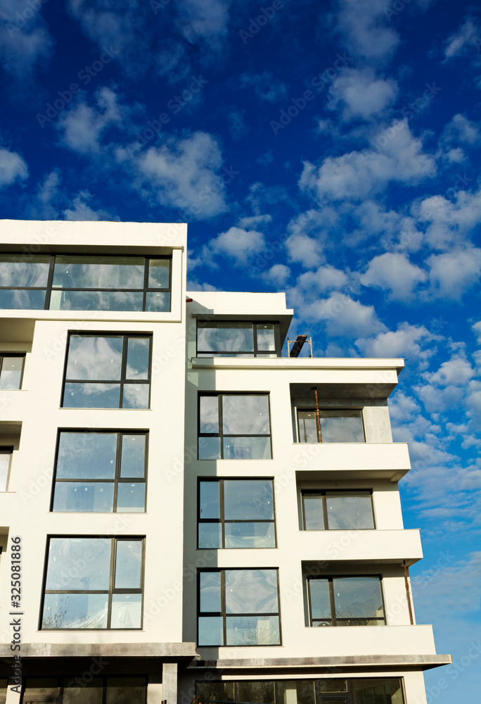 Ravda, Bulgaria, November 27, 2019. Low-rise construction in Bulgaria. New building in the city with building structures for further coloring. House on a clear sunny day with blue sky on background. Ravda, Bulgaria, November 27, 2019. Low-rise construction in Bulgaria. New building in the city with building structures for further coloring. House on a clear sunny day with blue sky on background.