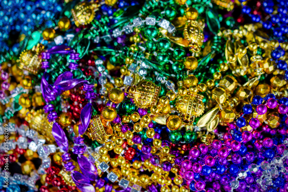Top down view of colorful festival beads with a shallow depth of field.