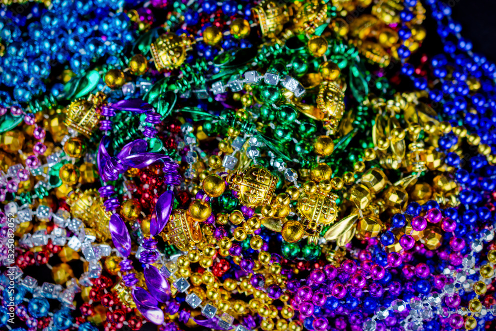 Top down view of colorful festival beads with a shallow depth of field.