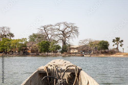 Blick aus Einbaum auf kleines Inseldorf in der Casamance, Senegal photo