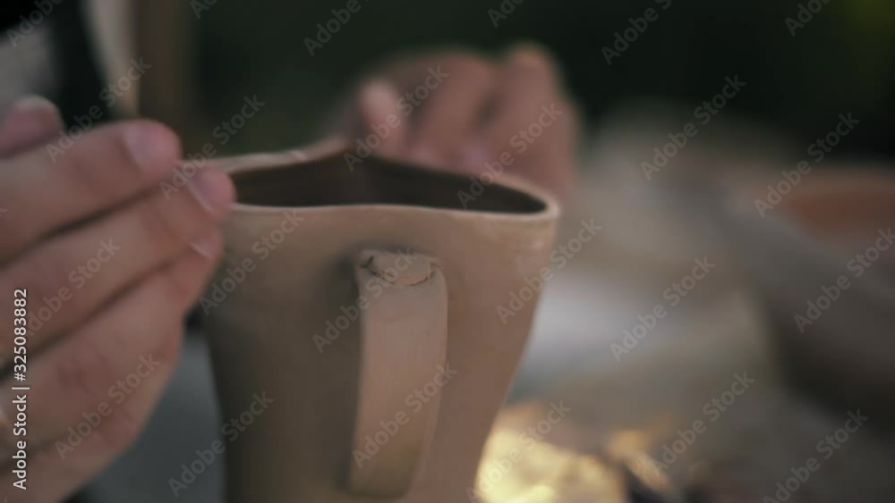 Close-up, Hands of The Potter Woman Processing Clay Mug Close-up, Hands of The Potter Woman Processing Clay Mug