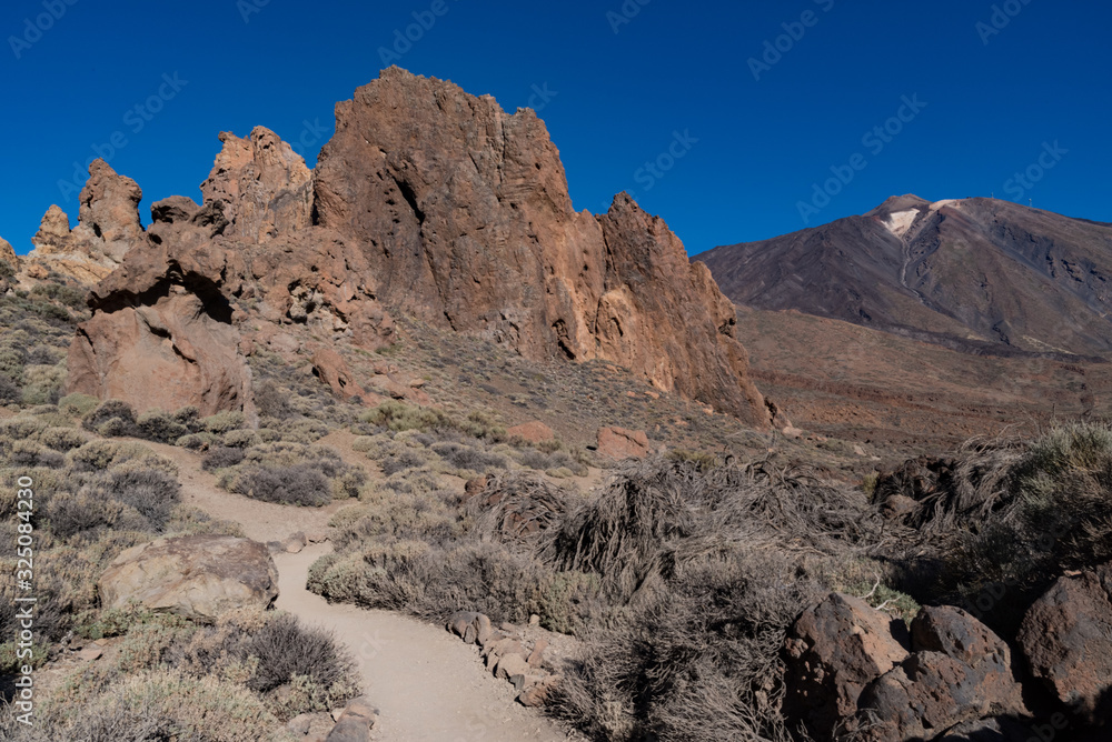  View of Roques de García unique rock formation with famous Pico del Teide mountain volcano summit in the background on a sunrise, Teide National Park, Tenerife, Canary Islands, Spain