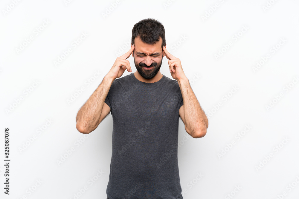 Young handsome man over isolated white background with headache Young handsome man over isolated white background with headache