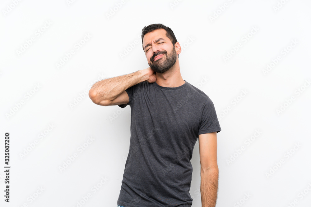 Young handsome man over isolated white background with neckache Young handsome man over isolated white background with neckache
