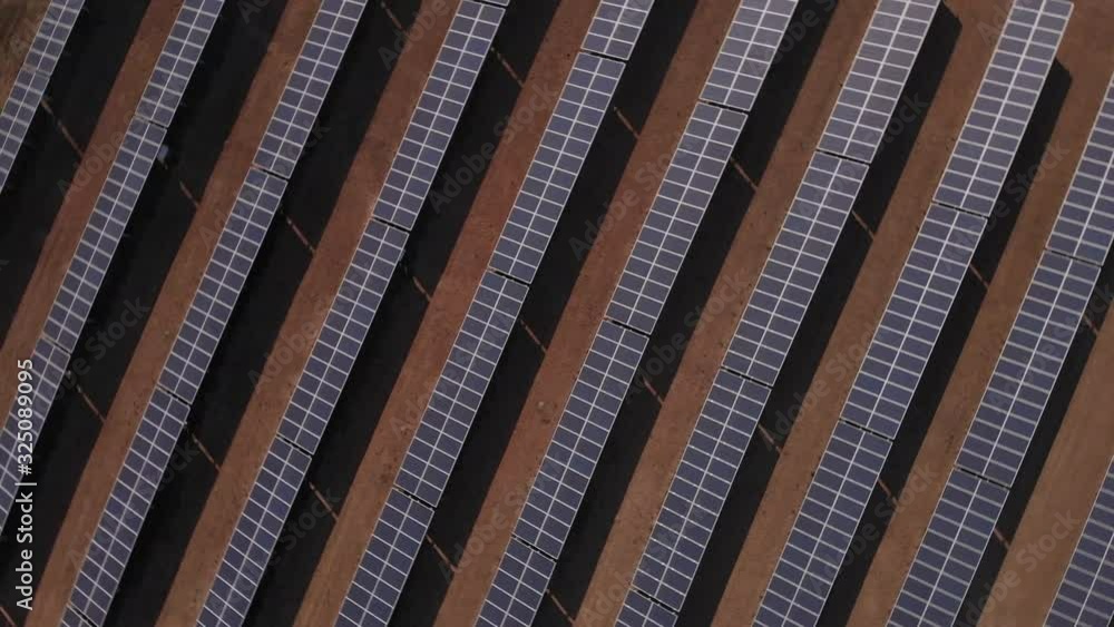 4k overhead drone aerial spinning shot above solar panels, panning downward, close up 4k overhead drone aerial spinning shot above solar panels, panning downward, close up
