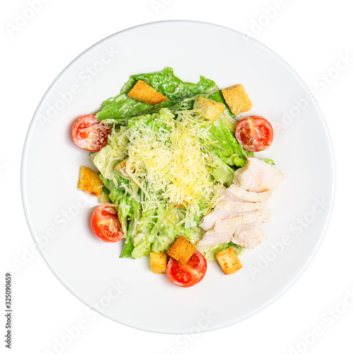 Fresh caesar salad in a plate on the white background. The view from the top.