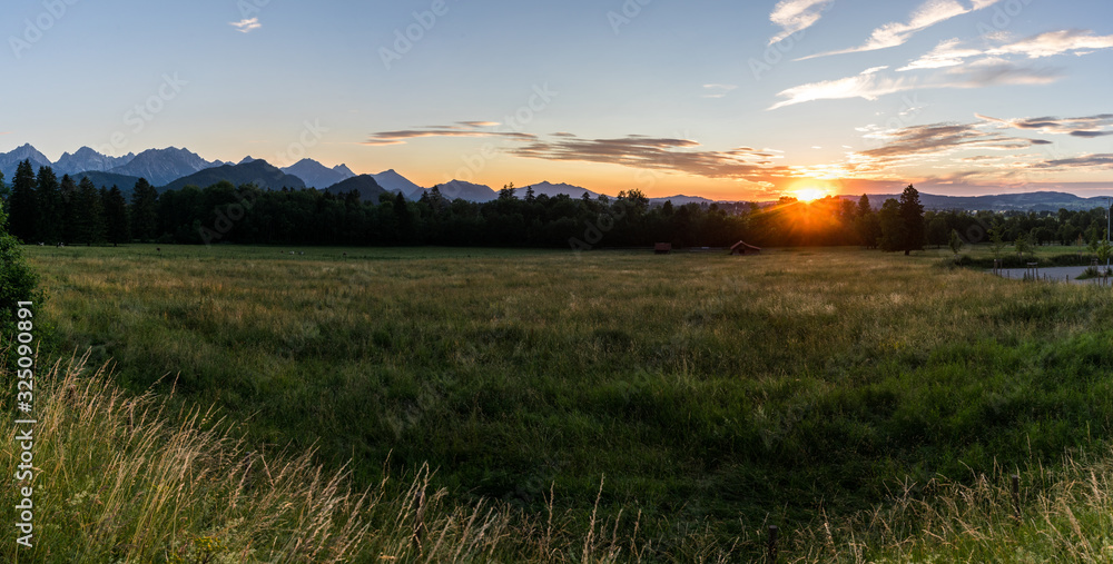 Panorama Sunset in the bavarian alps with blue sky