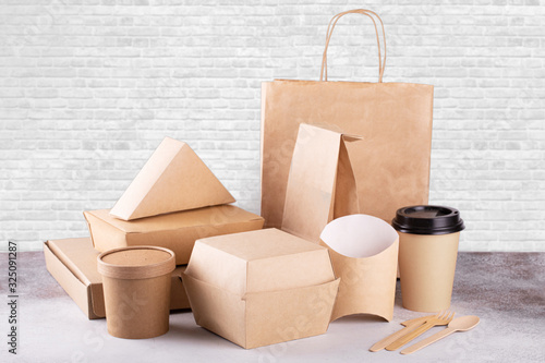 Recycling concept. Delivery food background. Fast food eco packaging on white wall background photo
