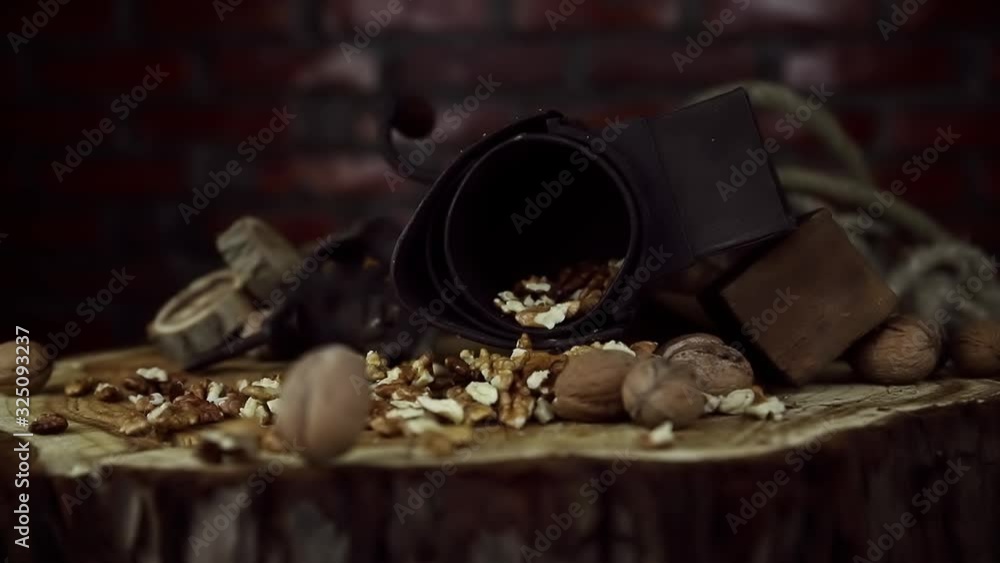 Walnuts Falling in Slow Motion on Rustic Old Table with Vintage Hand Grinder Walnuts Falling in Slow Motion on Rustic Old Table with Vintage Hand Grinder