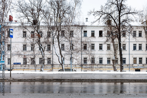 cityscape with wet road and old house in Moscow photo