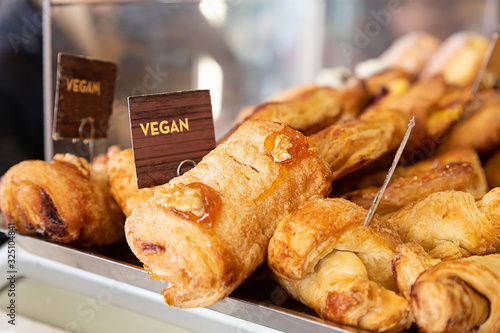 Vegan dessert with jam displayed in a pastry shop. Healthy lifestyle. Eat vegan for breakfast at a bar