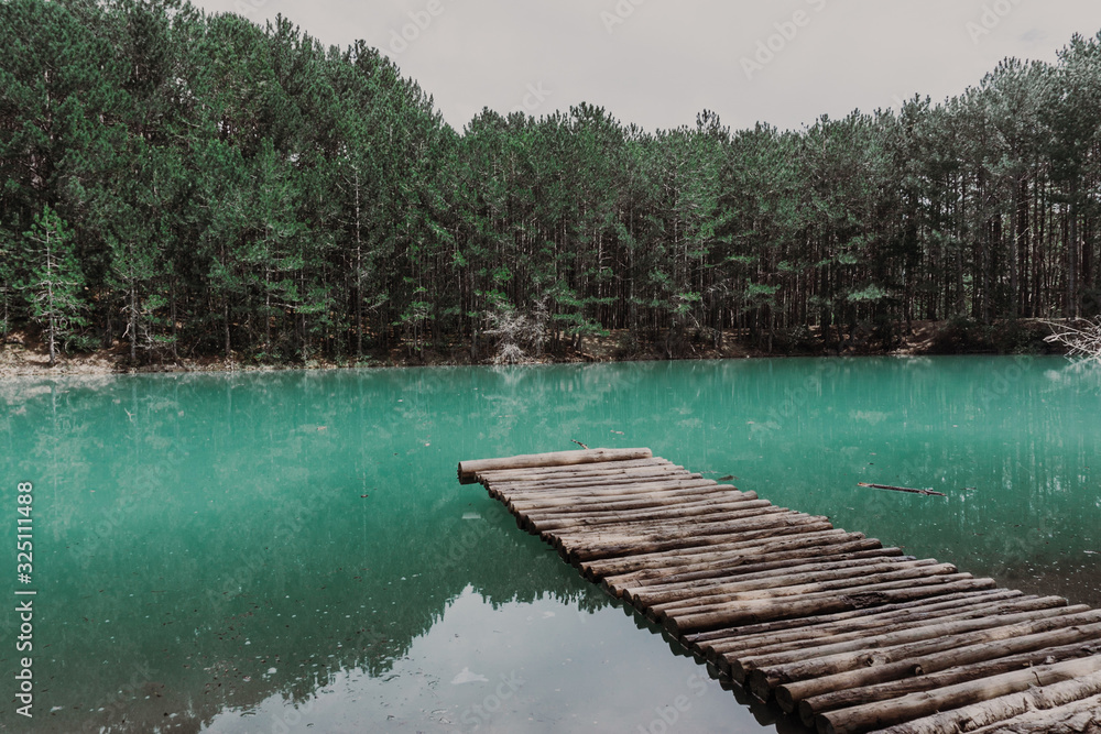 Fototapeta premium Beautiful turquoise lake in Crimea with the forest