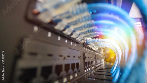 Blue network cable system in network rack have beautiful lighting and center picture focusing