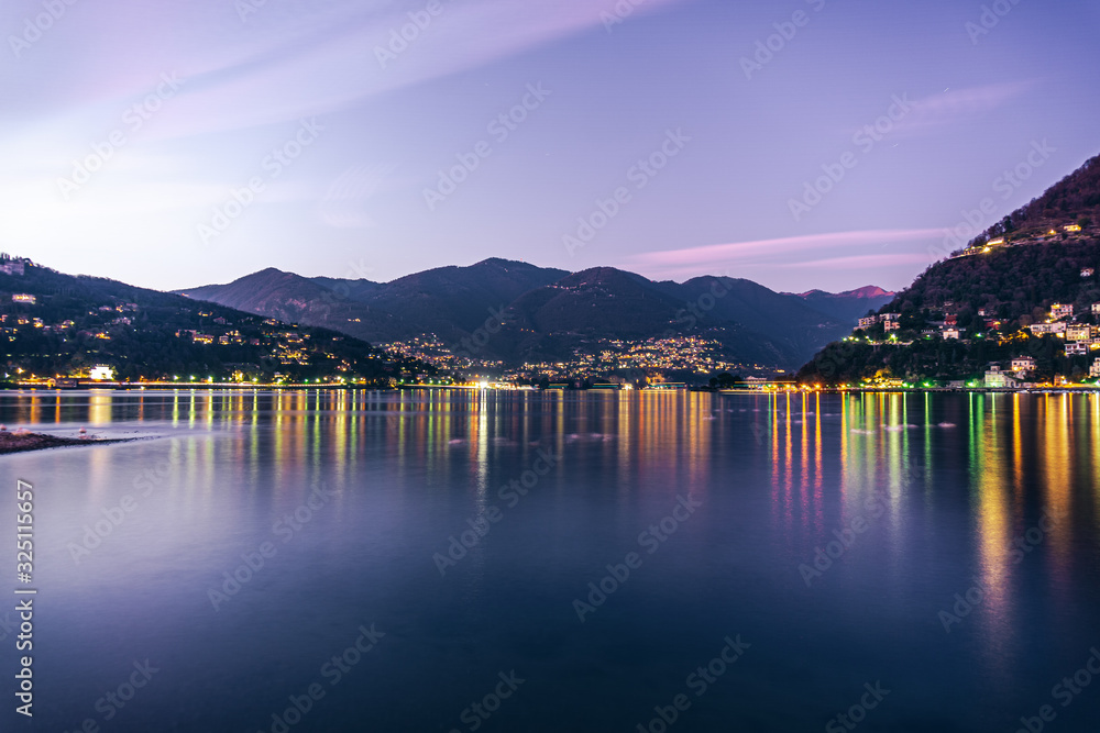 Lake Como, in the Italian Alps, during sunset, near the town of Como, Italy - February 2020.