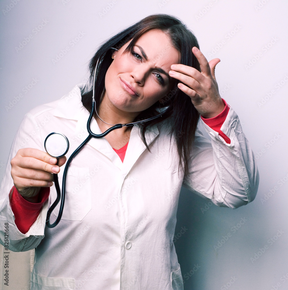 portrait of young smiling doctor with stethoscope portrait of young smiling doctor with stethoscope