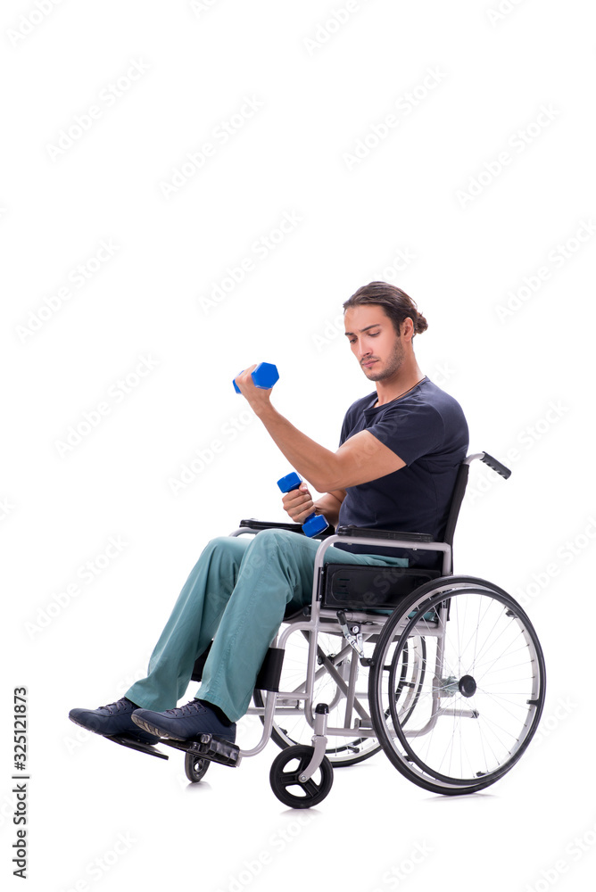 Young disabled man doing physical exercises isolated on white Young disabled man doing physical exercises isolated on white