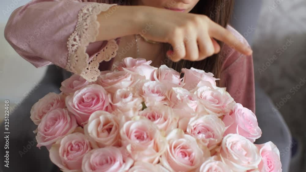 Woman counting flowers in a bouquet Woman counting flowers in a bouquet