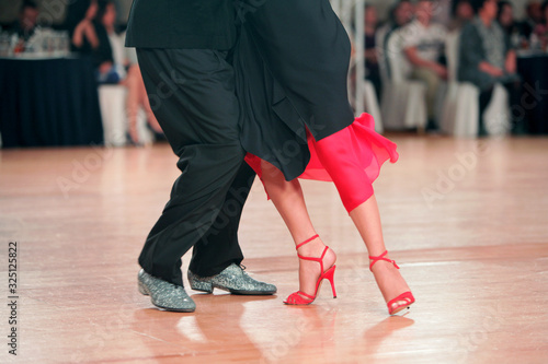 Beautiful woman in red dress dancing Argentinian tango  © 1L26