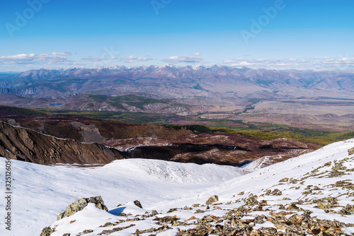 Mountain landscape, view from a snowy mountain peak. Uchitel pass, Severo-Chuysky ridge, Altai Republic, Russia photo