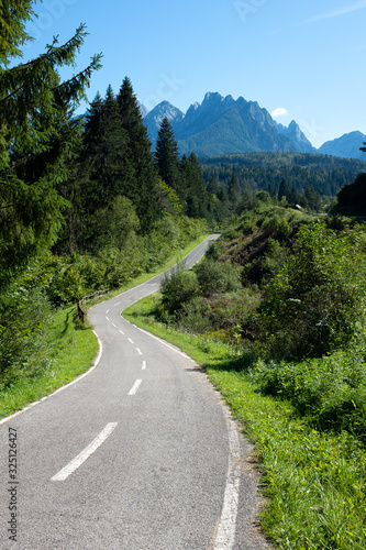 Famous bicycle route Alpe Adria trail made from old railway. Beautiful scenic way in the valley of Alps for cyclist