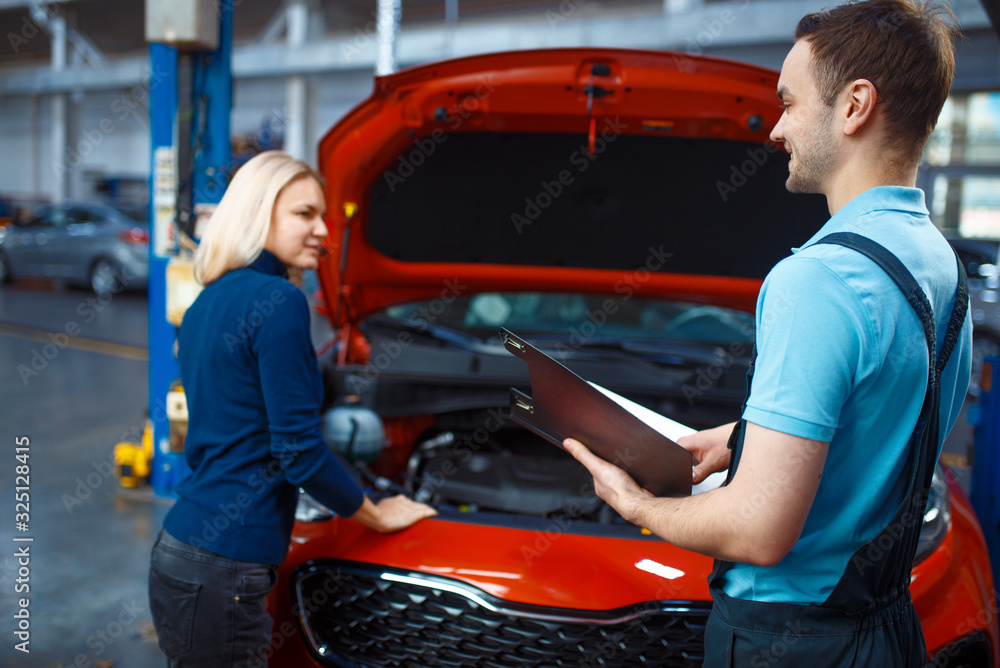 Driver and worker with checklist, car service Driver and worker with checklist, car service